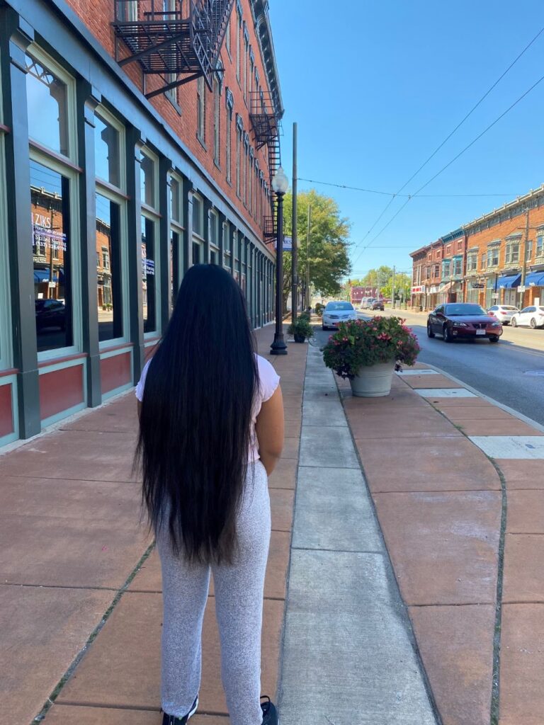 Teen girl looking down street