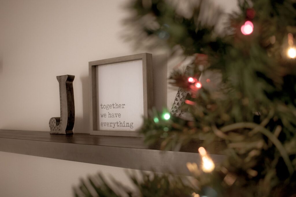framed words, together we have everything on a ledge next to a Christmas tree
