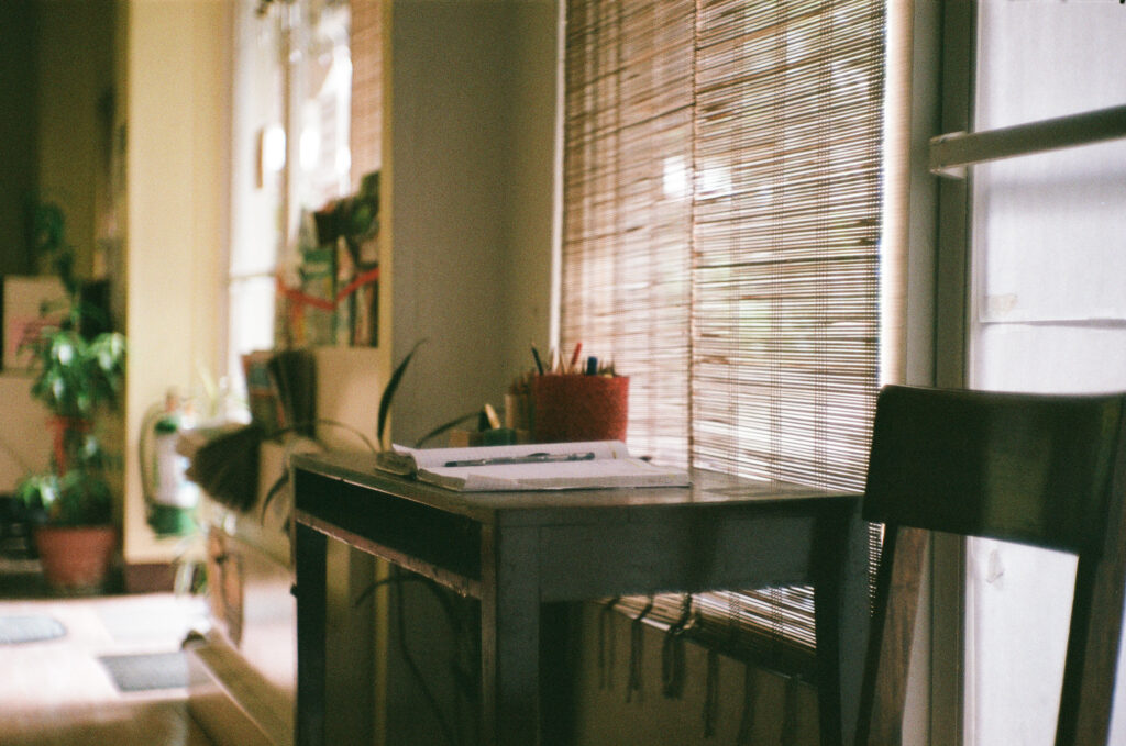 White table with chairs near window