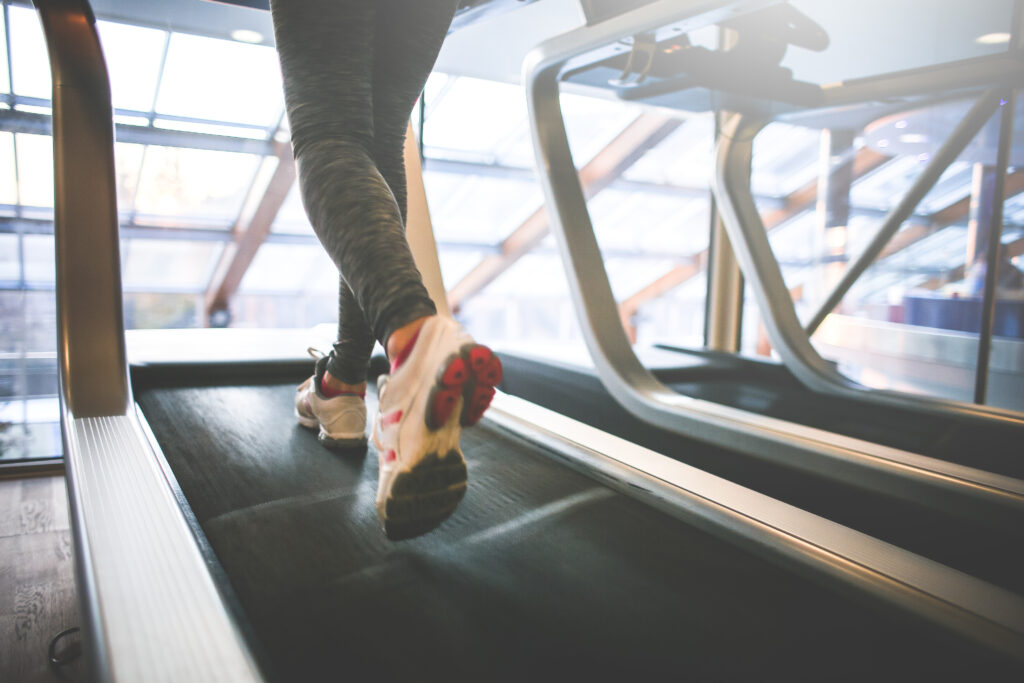 Woman walking on a treadmill