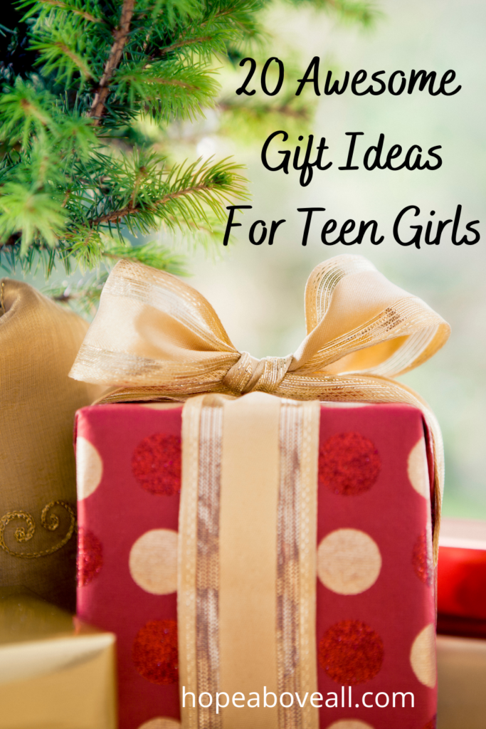 Christmas tree in the background and Christmas gift in the foreground with title of blog post in top right corner: 20 Awesome Gift Ideas For Teen Girls

