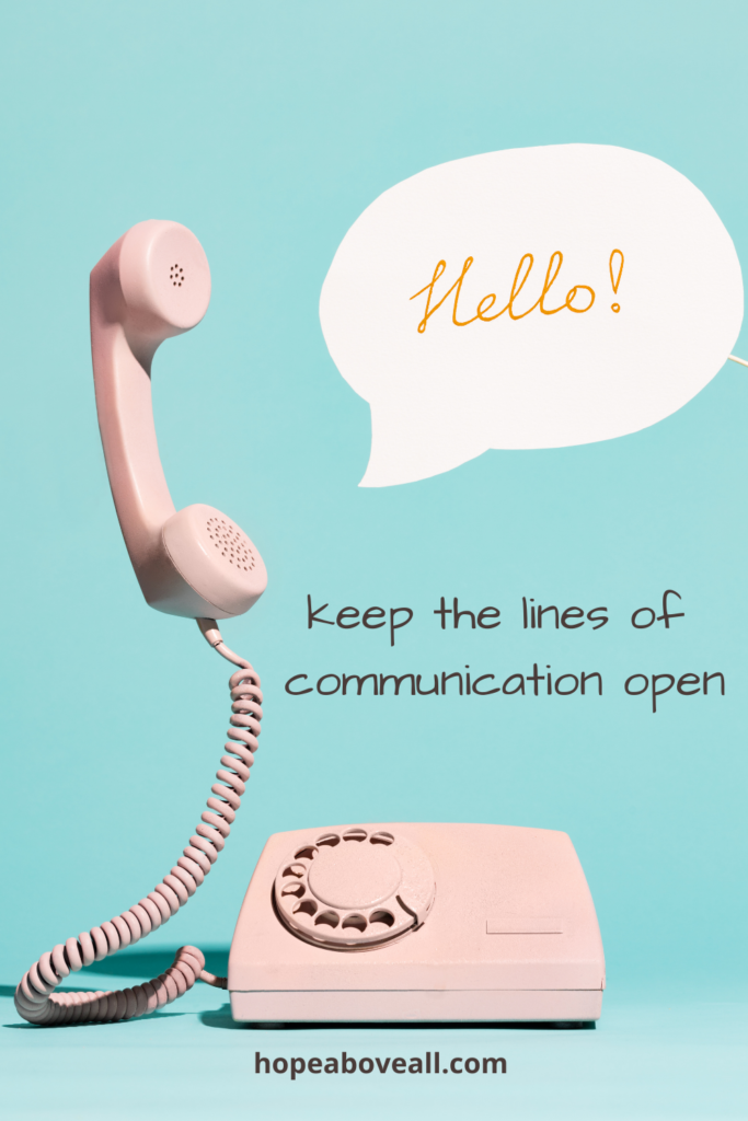 Photo of a rotary phone with a speech bubble saying hello and the words "keep the lines of communication open" in the middle of the photo.