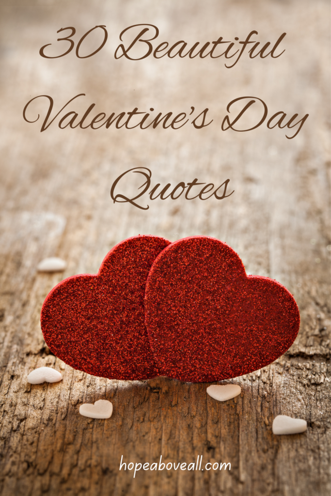 Pin with 2 red hearts sitting on a wooden floor with title at the top: 30 Beautiful Valentine's Day Quotes