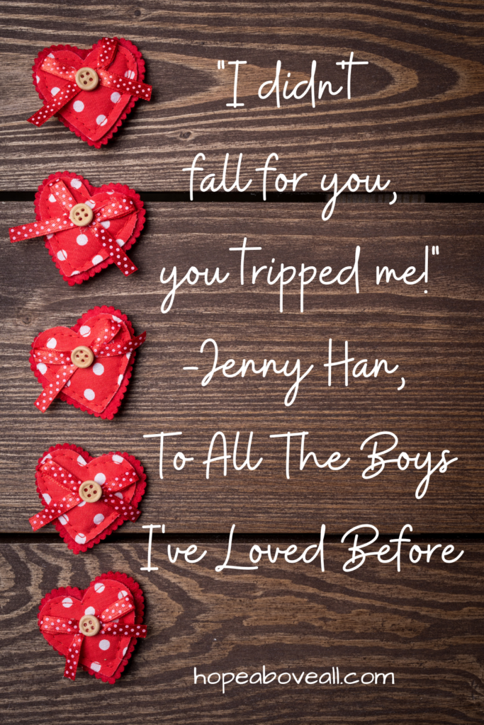 Wooden background with multiple red hearts down the left side and quote by Jenny Han written on the right.