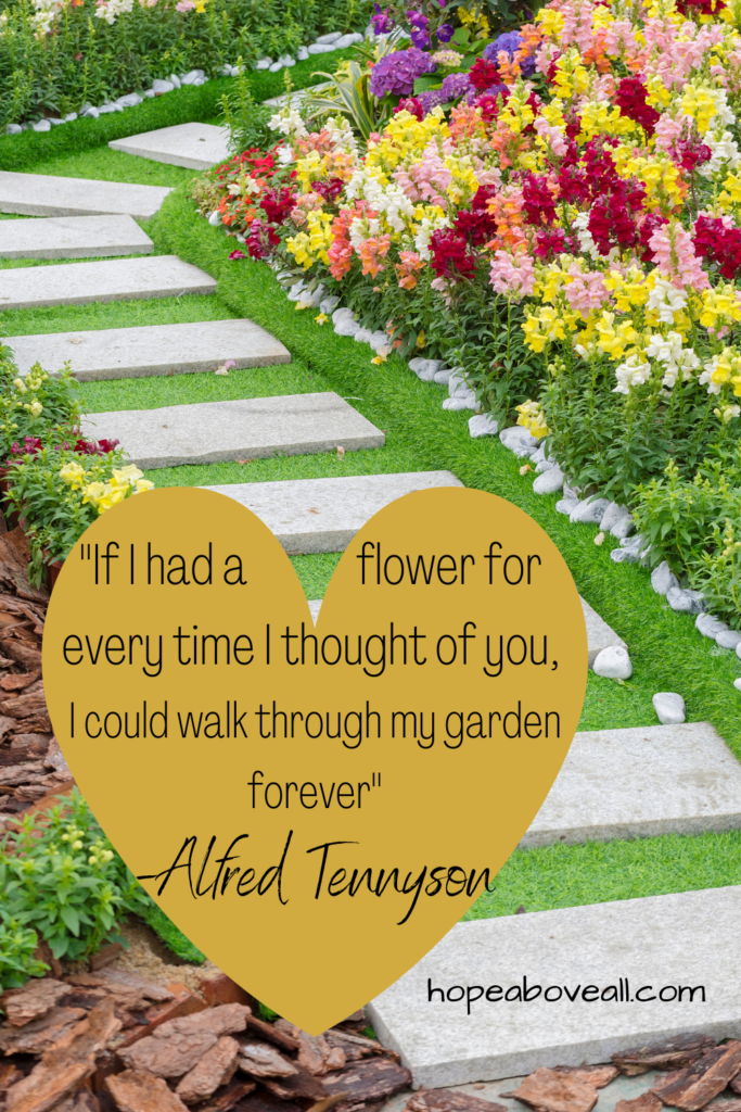 Photo of a garden and a golden heart with a quote by Alfred Tennyson written inside.