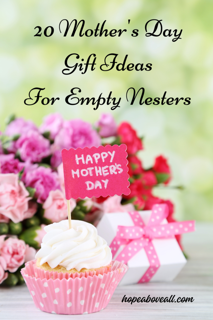 Cupcake with flag in it with Happy Mother's Day written on the flag.  A bouquet of flowers is in the background and the title of the pin: 20 Mother's Day Gift Ideas For Empty Nesters, is at the top.