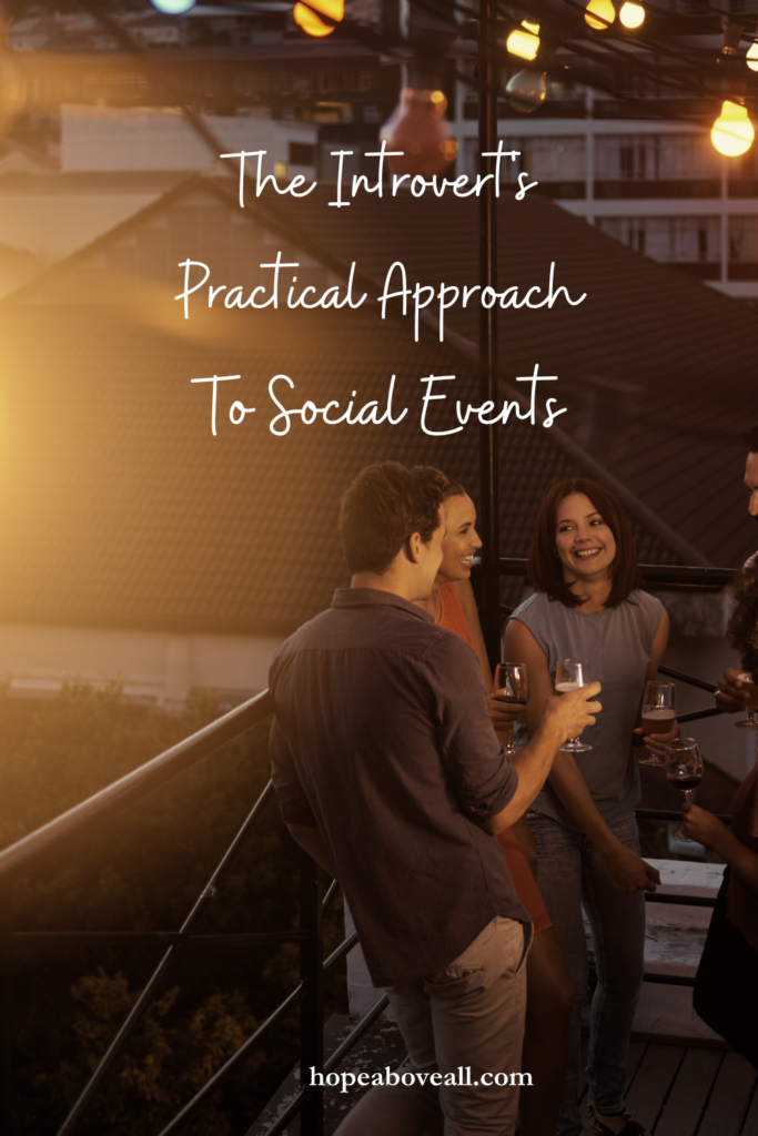 Image of friends at an outdoor social event holding drinks and talking and laughing.  The pin title: The Introvert's Practical Approach To Social Events is at the top of the image