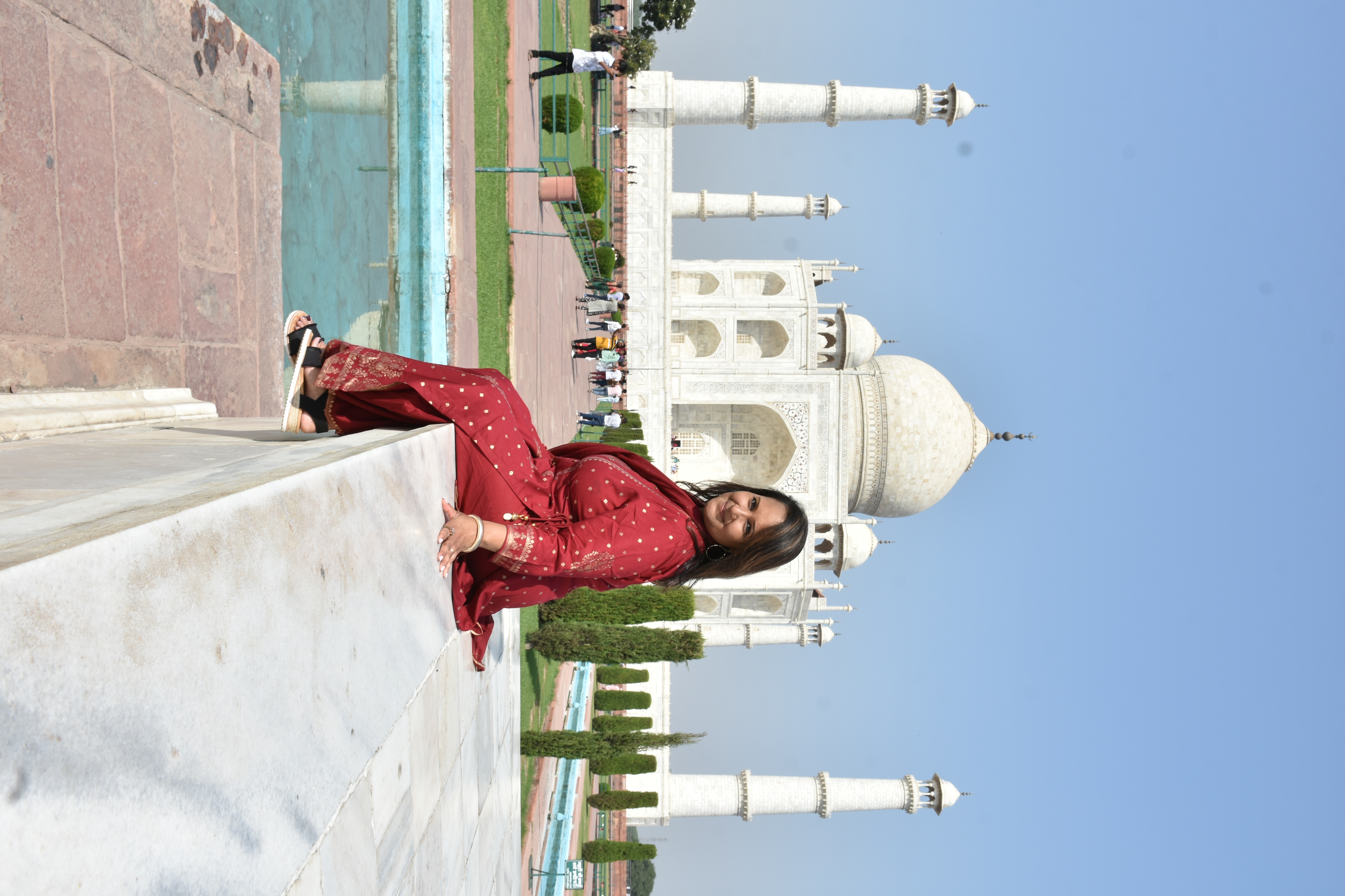 Photo of me posing with the Taj Mahal in the background