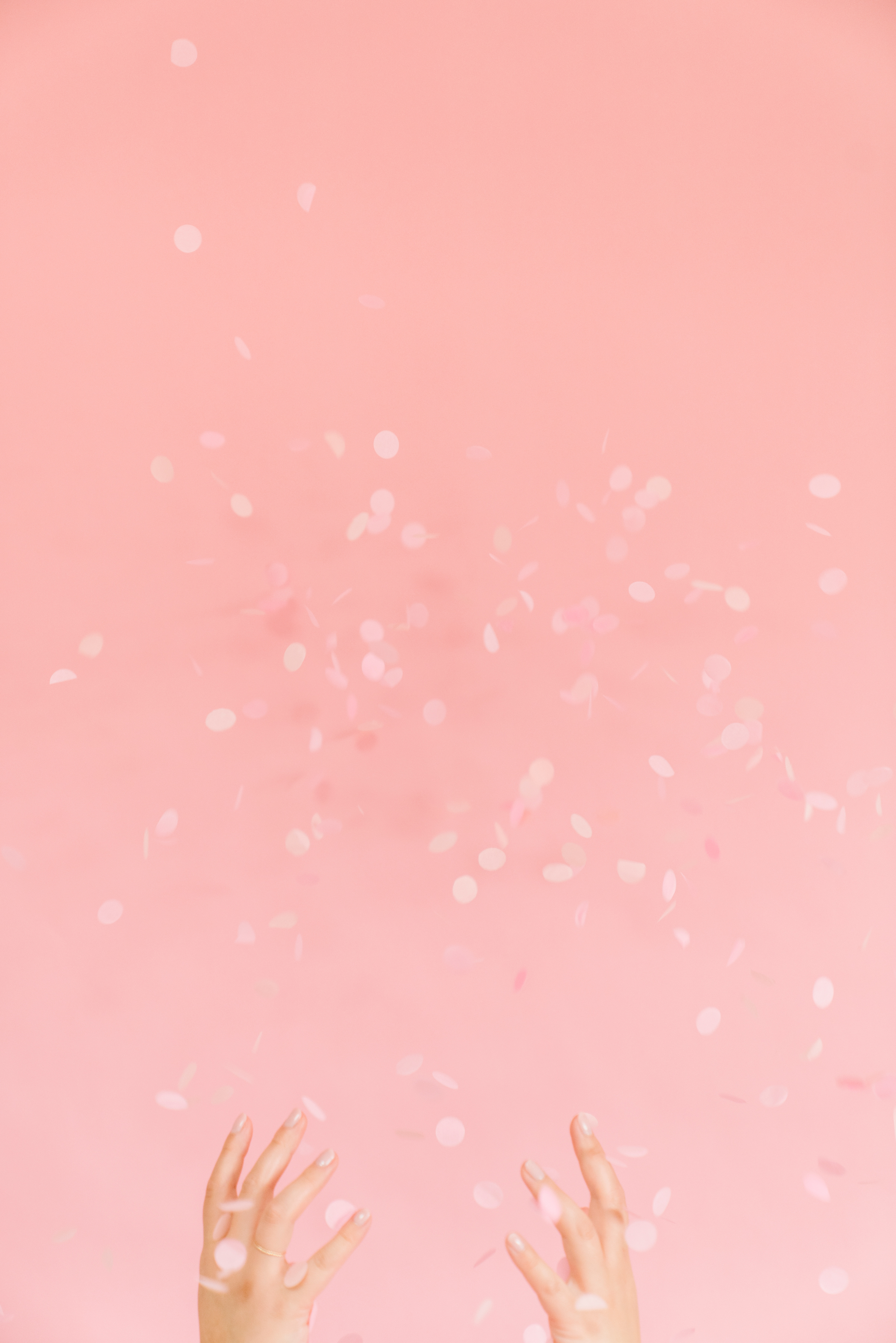 Person throwing confetti into the air