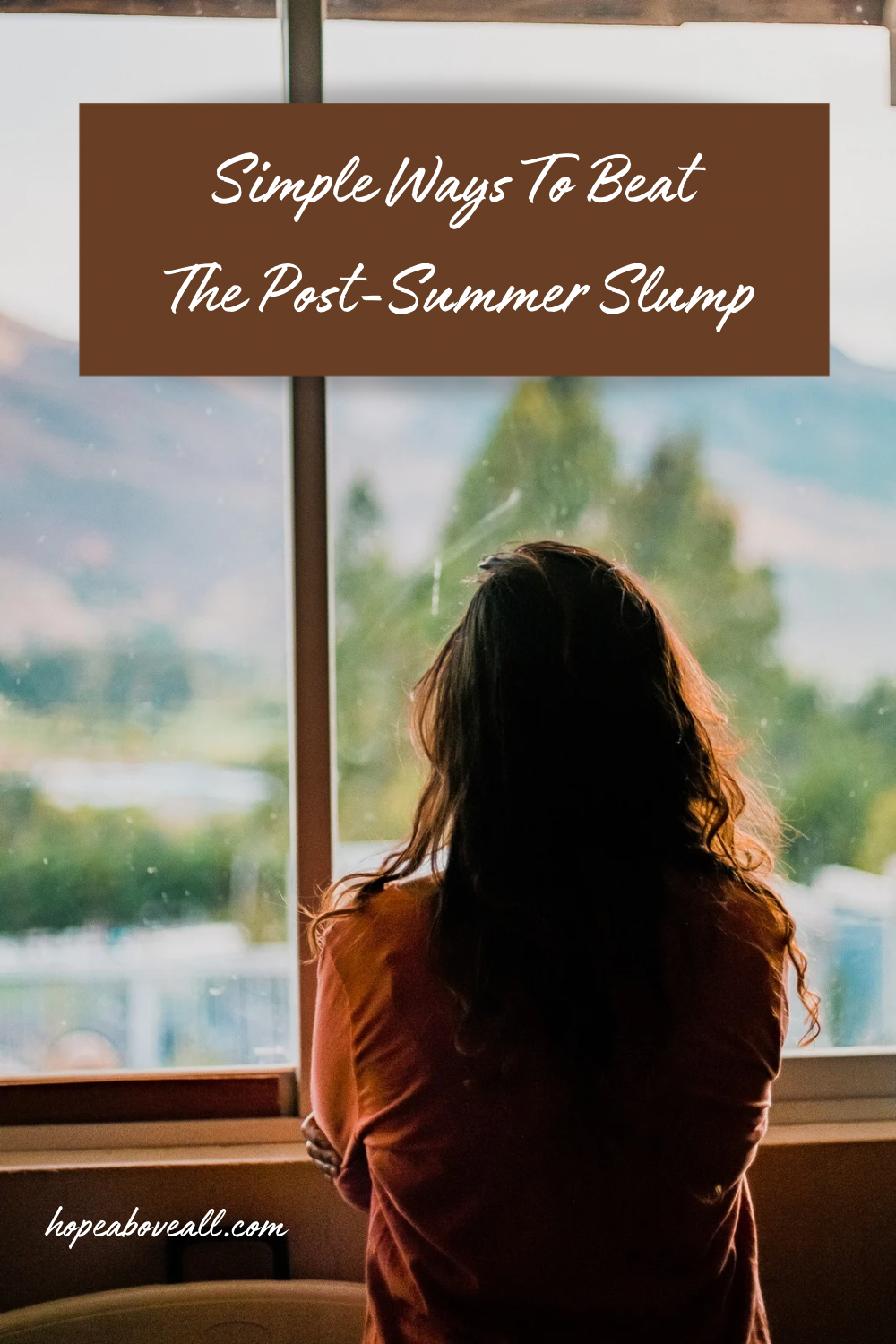 Woman staring out the window
Pin title: Simple Ways To Beat The Post-Summer Slump
