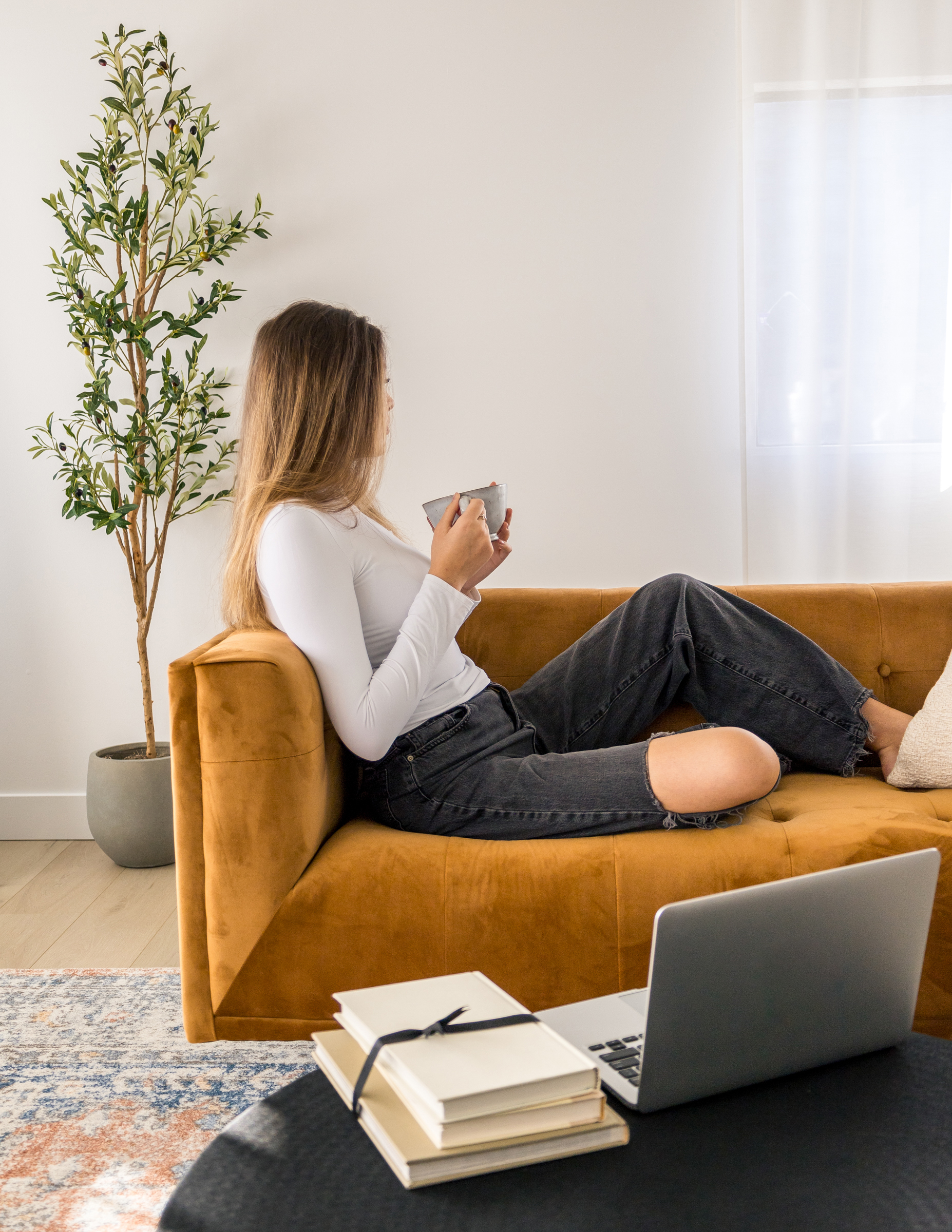 woman sitting on a sofa deep in thought
